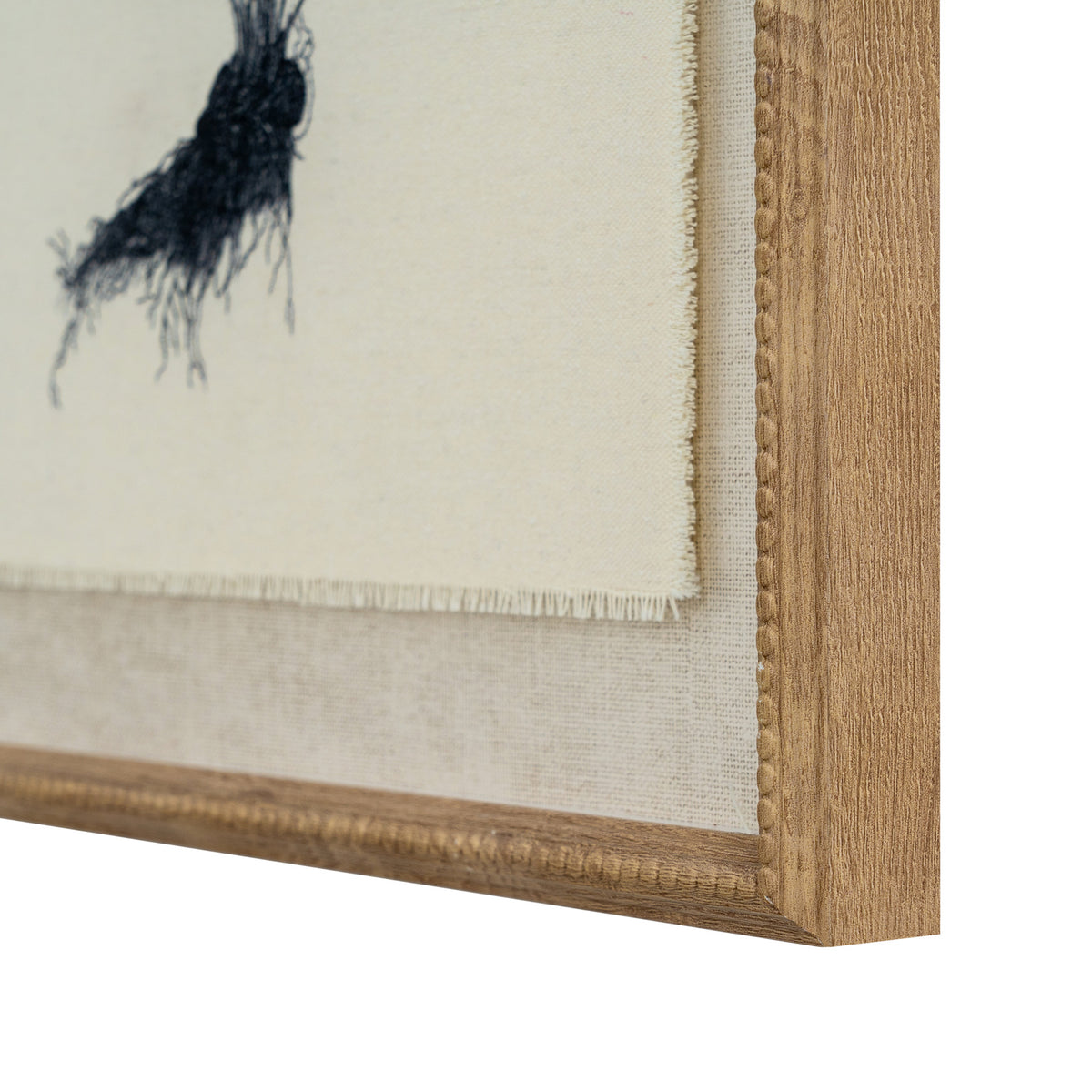 Close-up of the print's lower right corner, showing part of the fern roots, the fringed pale image edge, textured surround and beading along the frame.