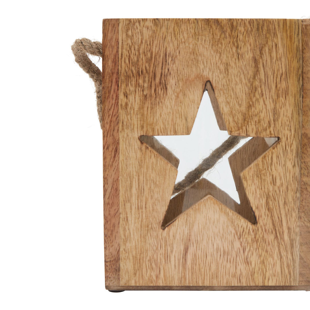 Close-up of a large star aperture surrounded by brown grain markings, with part of the rope visible behind it.