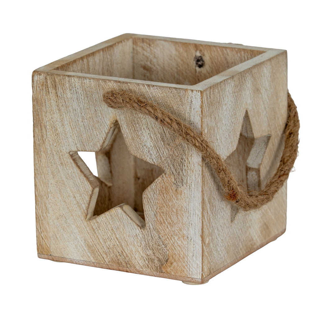 Angled view of a pale washed square candle holder with star cut-outs and a rope loop draped across the corner.