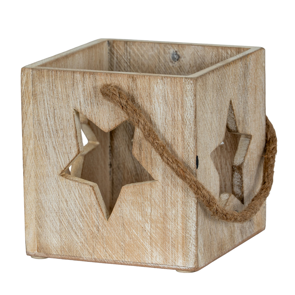 Three-quarter view of the pale washed square candle holder, with star cut-outs and a rope loop draped across the front corner.