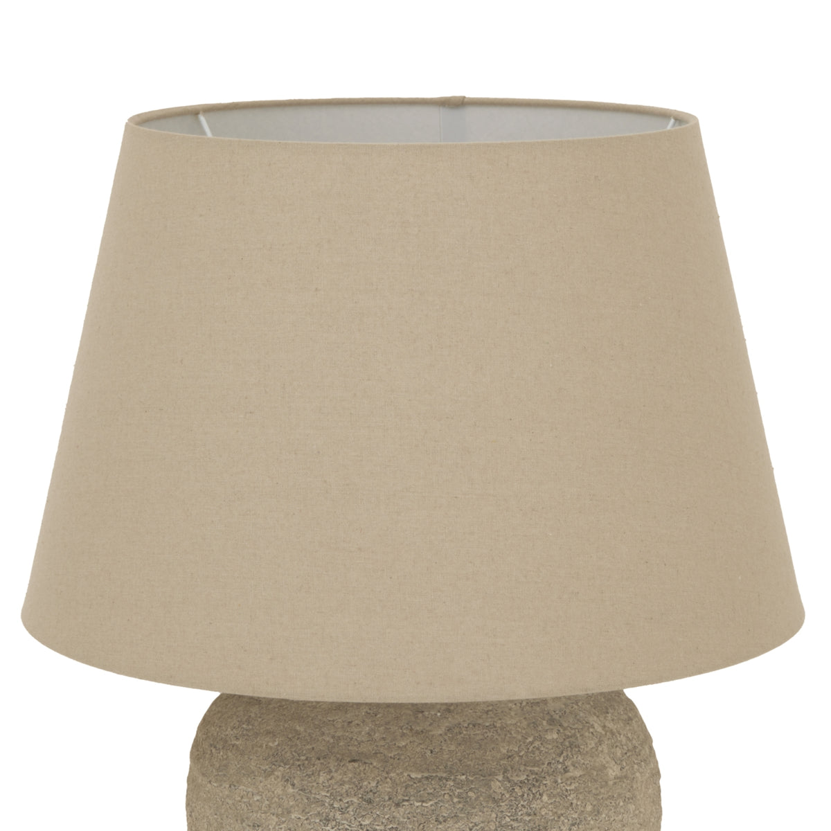 Close-up of the broad tapered beige lampshade, showing its fine woven appearance, open upper rim and part of the textured base below.