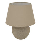 Rough Lowbase Table Lamp on a white background, showing its rounded mottled grey-beige base and broad tapered beige shade.