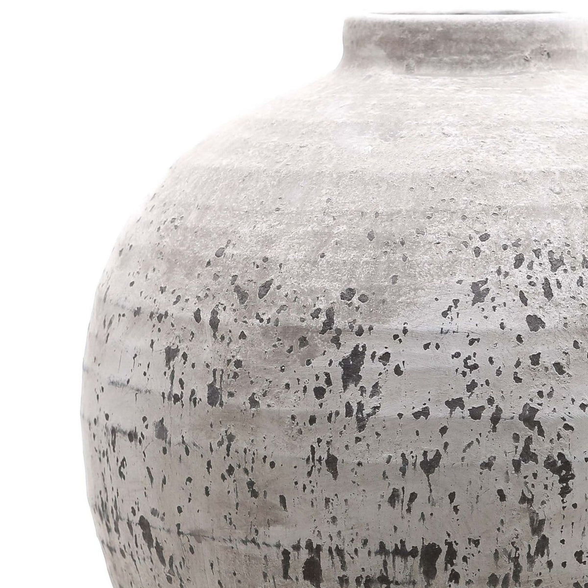 Close-up of the vase's curved shoulder and short neck, showing fine rough texture above dark speckles, streaks and bands.