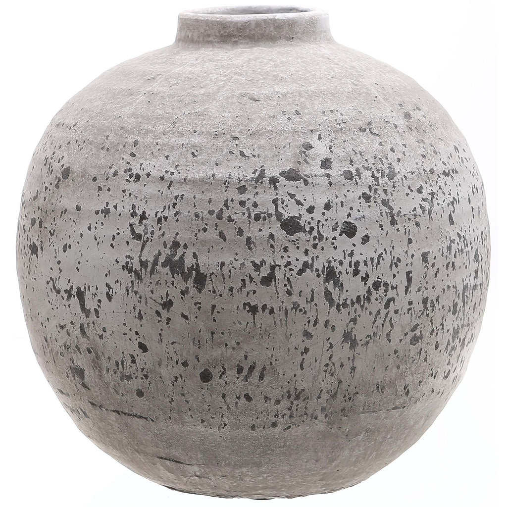Rounded grey-beige vase with a short open neck, rough surface and irregular dark speckles and horizontal bands against a white background.