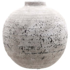 Grey-beige Rough Orbit Vase with an almost spherical body, short straight neck and dark irregular markings on a rough surface.