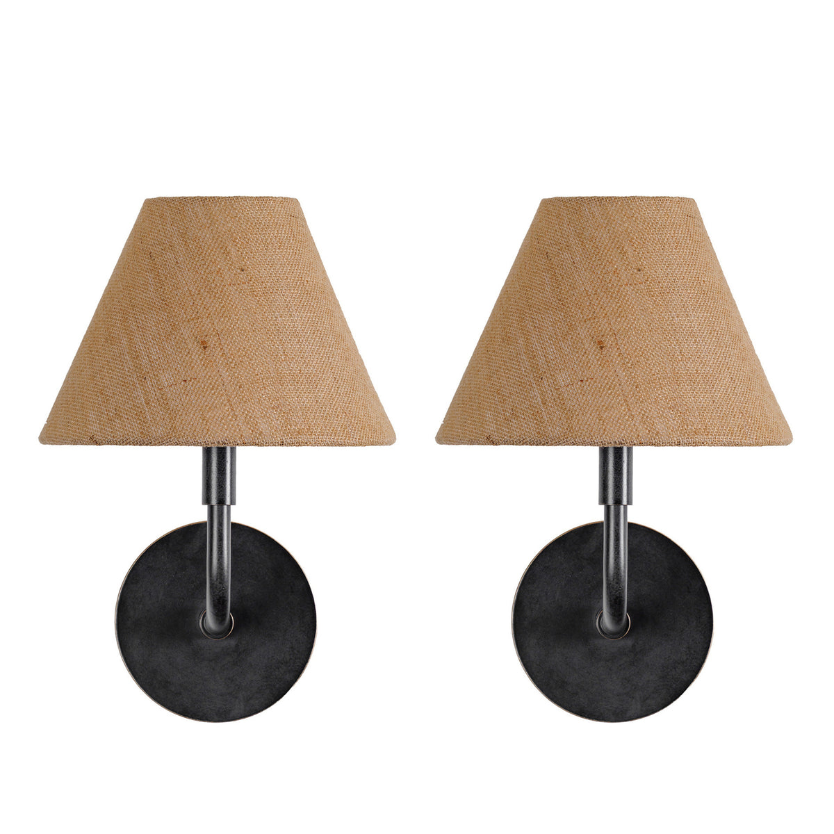 Front view of two matching wall lights with dark round backplates, curved arms and tapered tan fabric shades on a white background.
