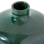 Close-up of the vase's rolled rim and curved shoulders, with fine crackle visible through the glossy green glaze.