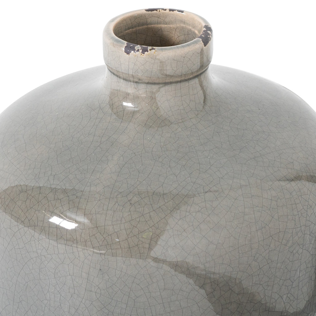 Close view of the vase’s open neck and thick rolled rim, with fine crackle lines and dark worn-looking patches in the grey glaze.