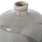 Close view of the vase’s open neck and thick rolled rim, with fine crackle lines and dark worn-looking patches in the grey glaze.