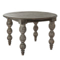 Round dining table shown against white, with a patterned grey-brown top and profiled outer edge.