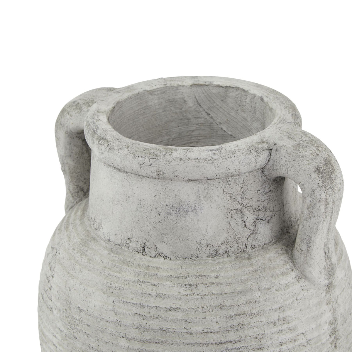 View from above of the vase opening, thick rim and curved handles, showing dark mottling across the pale finish.