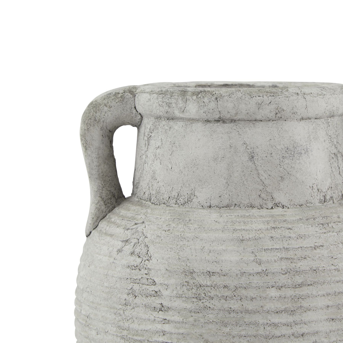 Close-up of one curved handle beside the short neck and ribbed shoulder, with crackle-like markings in the weathered finish.