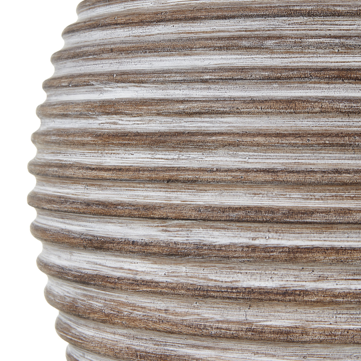Close-up of the lamp base showing brown horizontal ridges with pale streaks and a mottled surface.