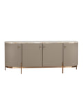 Front view of a rounded sideboard with four taupe doors, a marble top and slender legs on a brushed-gold base, against a white background.