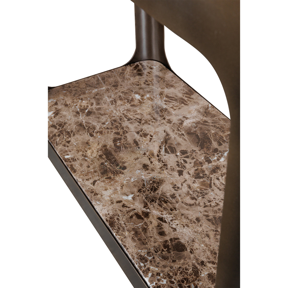 Close-up of the brown marble base shelf, showing pale veining and its rounded corner within the iron frame.
