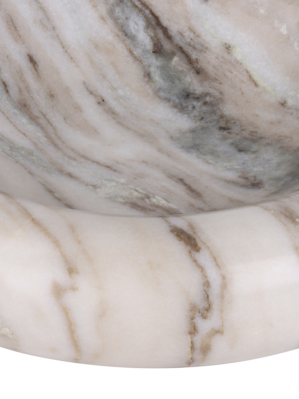 Detail of the rounded marble rim and interior, with warm brown veins crossing the pale polished surface.