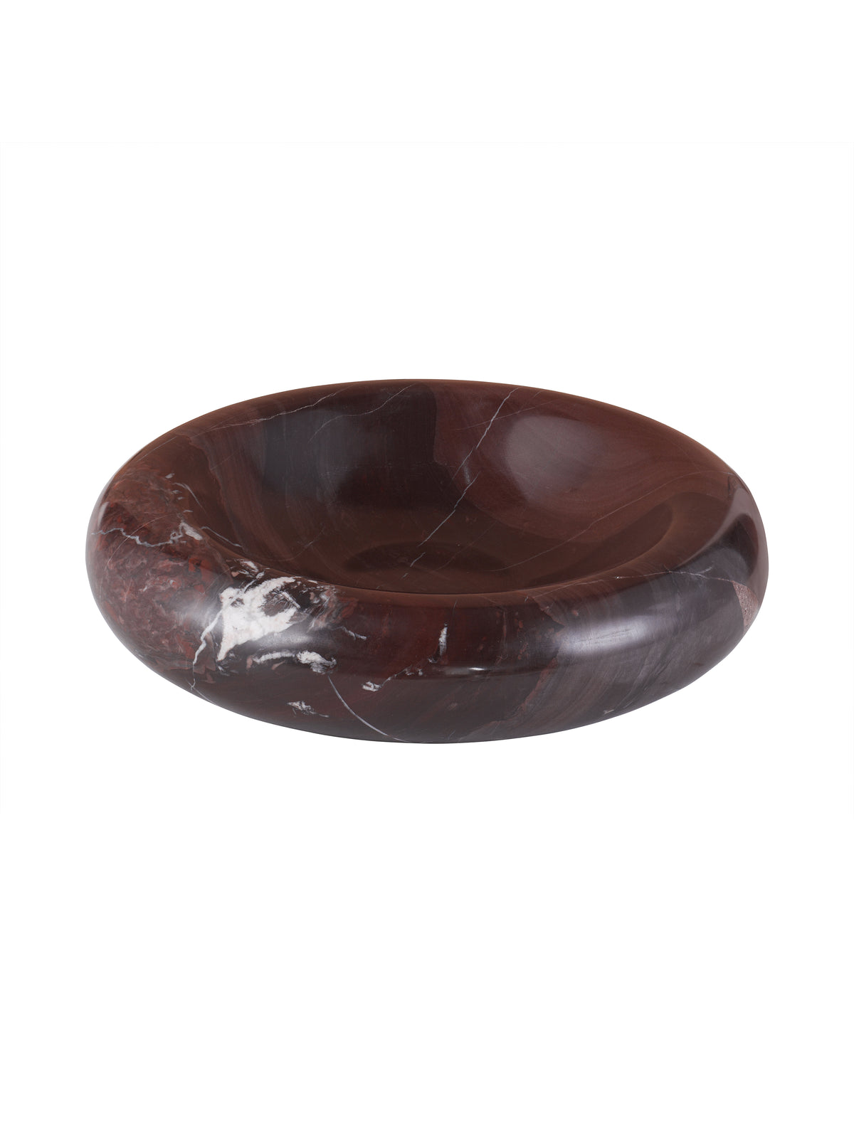 Angled view of a low red marble bowl with a broad rounded rim and pale natural veining on a white background.