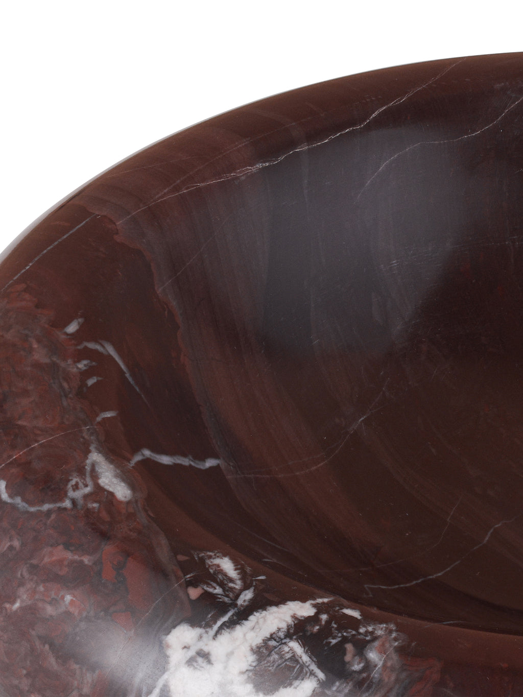 Close-up of the bowl's rounded rim and interior, showing dark red stone with fine pale veins and white markings.