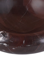 Detail of the polished bowl interior and front rim with burgundy colouring and branching pale veins.
