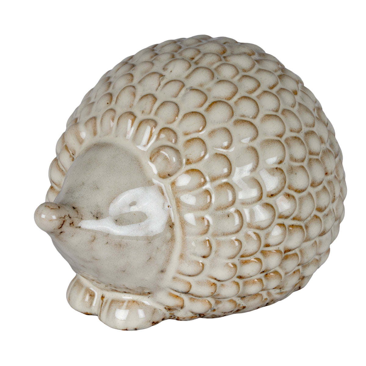 Three-quarter view of a cream-white hedgehog decoration with a domed scale-patterned back, pointed snout and short front feet.