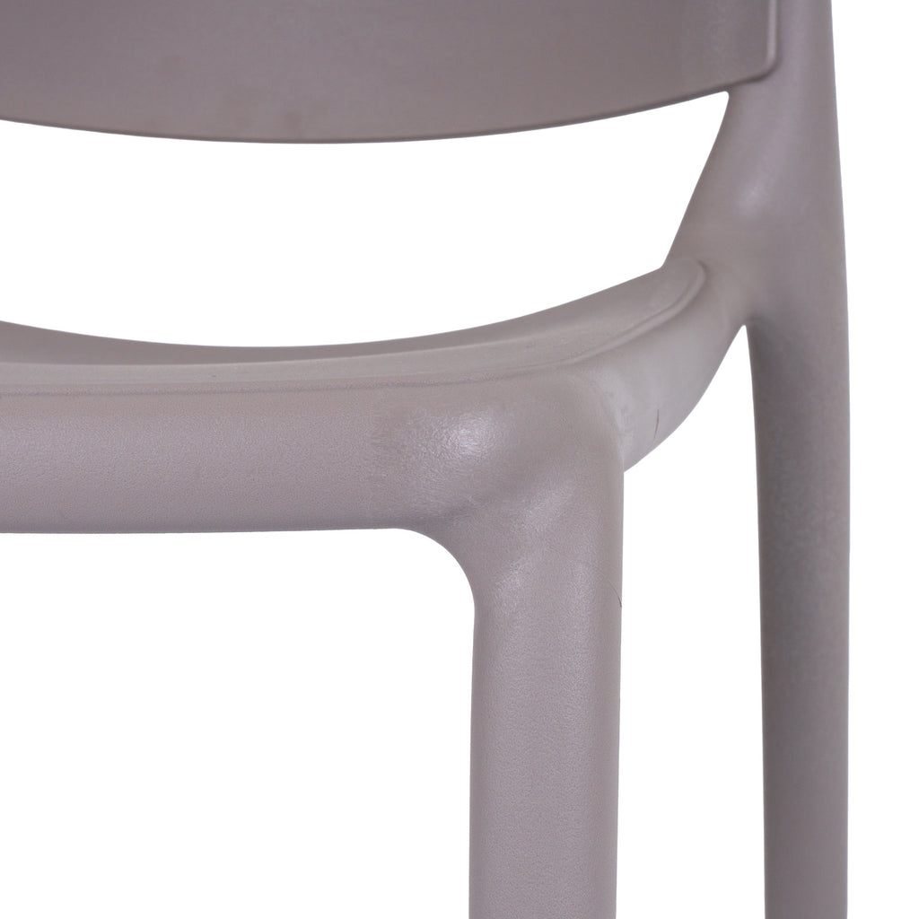 Close-up of the grey chair's seat edge, lower back panel and legs, showing the fine pebbled surface texture.