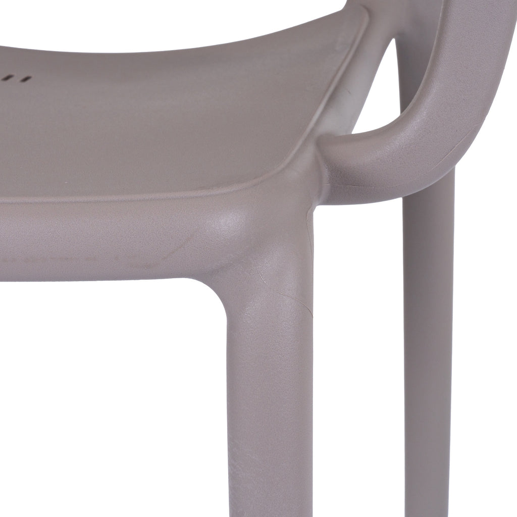 Close-up of the grey chair's seat edge, curved arm and legs, showing the fine pebbled surface texture.