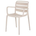 Front three-quarter view of a pale putty dining chair with three curved back panels, open arms and four slim legs.