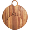 Two overlapping round brown boards with circular handle openings, the smaller board in front of the larger, showing contrasting vertical grain against white.