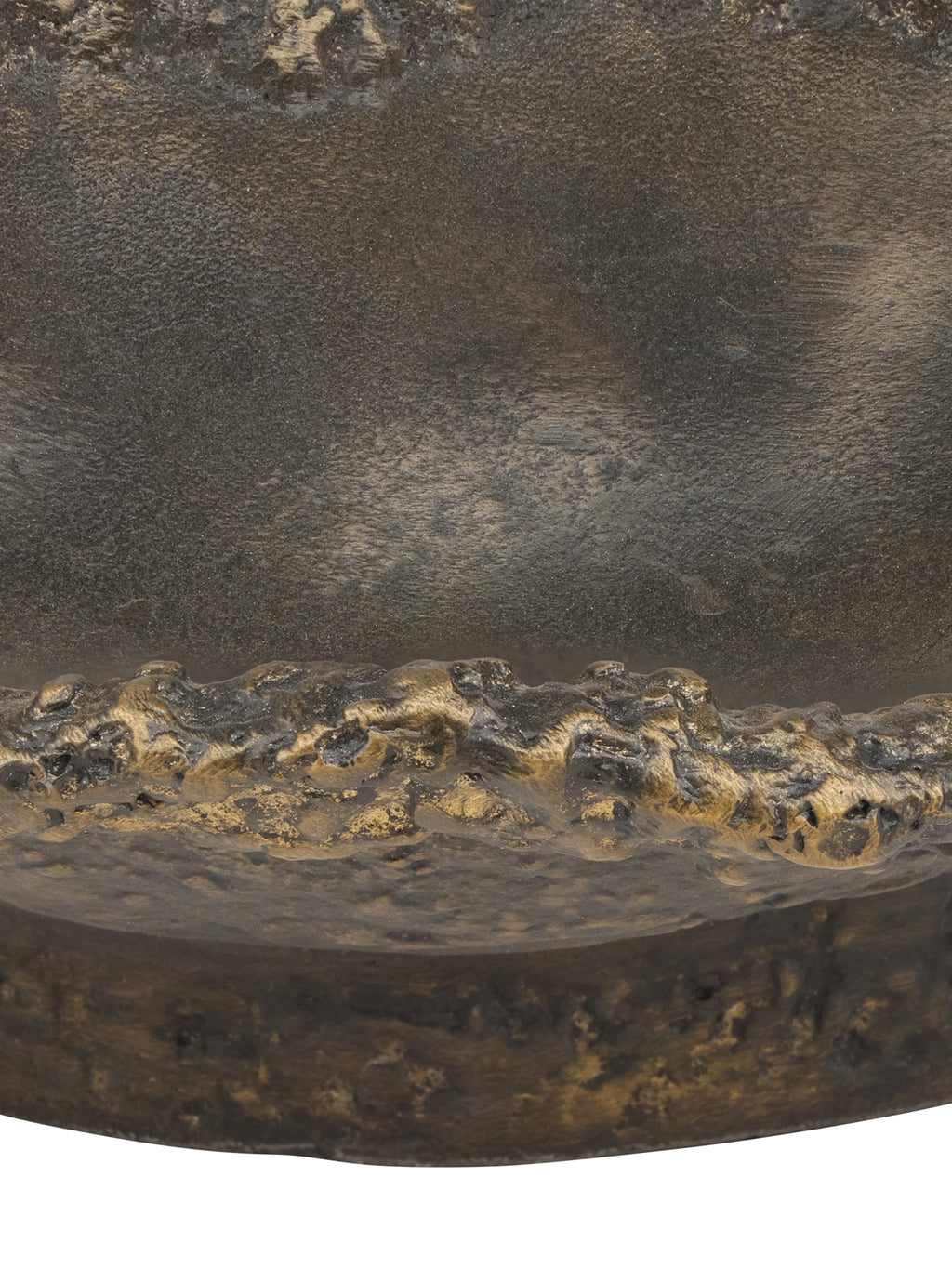 Detail of the bowl's highlighted irregular front edge, textured exterior and circular base.