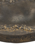 Detail of the bowl's highlighted irregular front edge, textured exterior and circular base.