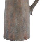 Detail of the jug's lower body and base, with pale grey flecks and dark vertical streaks over a rust-brown finish.