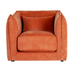 Front view of the rust-orange armchair, showing curved sides around a thick seat cushion, a rectangular cushion and short dark feet.