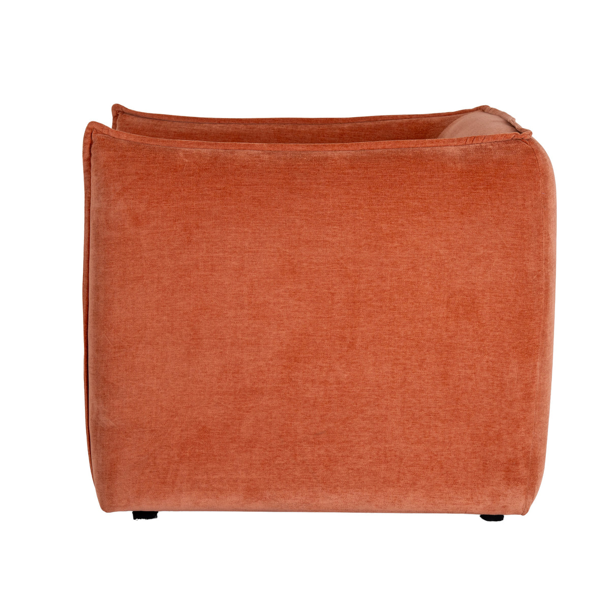 Rear view of the rust-orange armchair, showing its broad rounded back, raised edging and short dark feet.