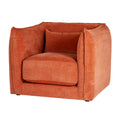 Three-quarter front view of a rust-orange armchair with rounded enclosing sides, a thick seat cushion and a matching rectangular cushion.