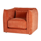 Three-quarter front view of a rust-orange armchair with rounded enclosing sides, a thick seat cushion and a matching rectangular cushion.
