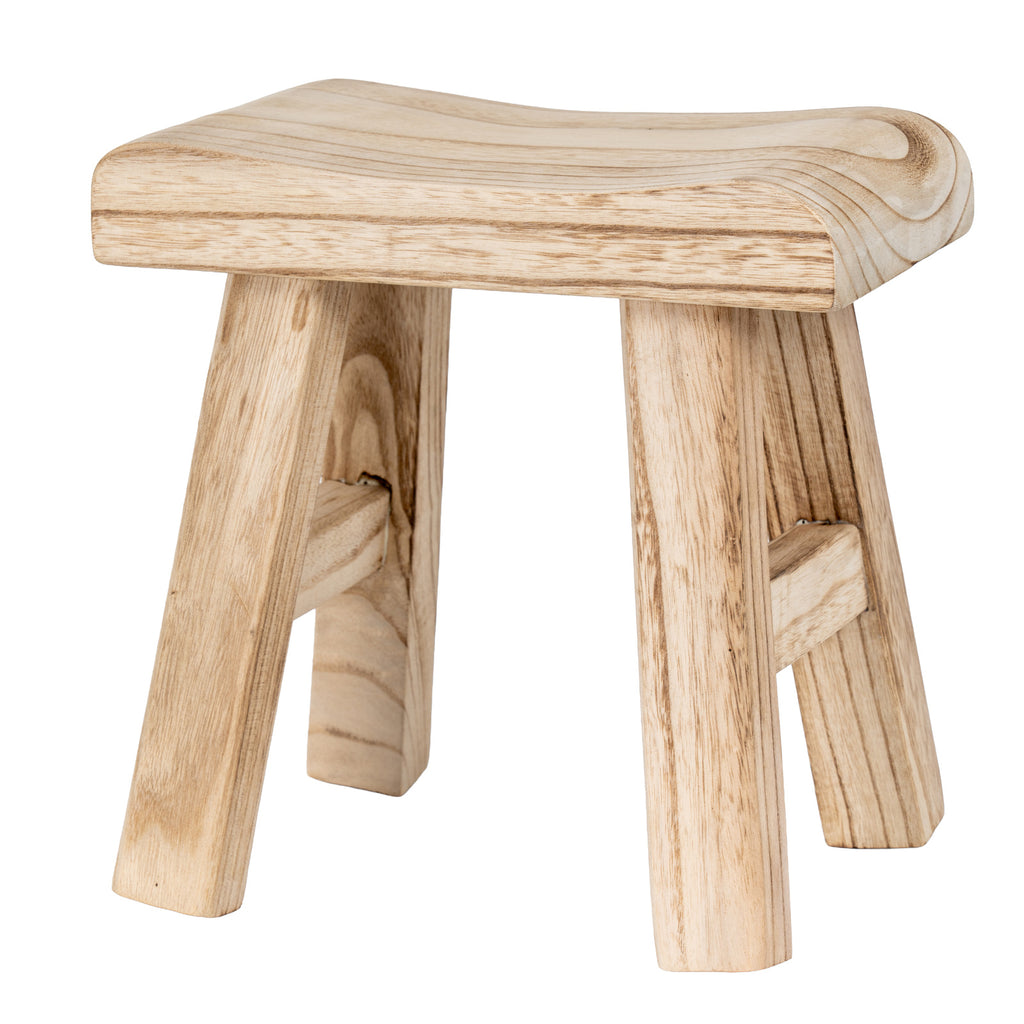 Pale tan stool viewed almost straight on, showing a curved seat, four splayed legs and side crossbars against white.