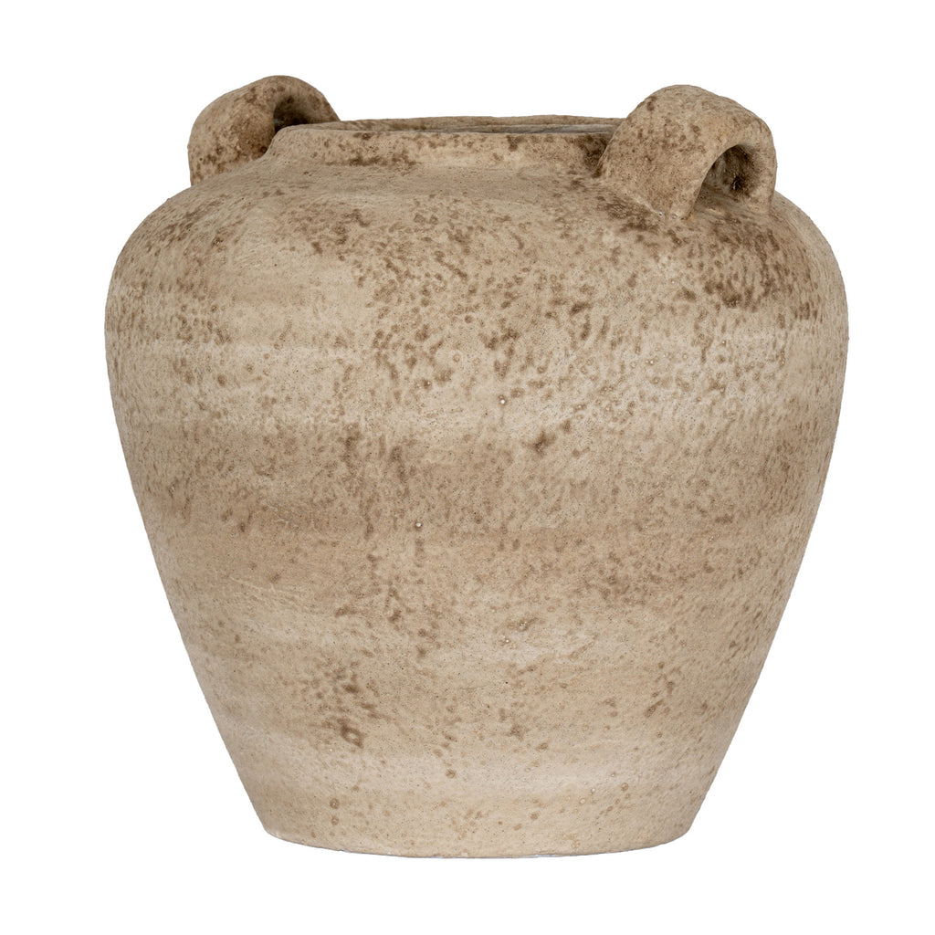 Angled view of the mottled sandy-brown vase showing the openings beneath its thick loop handles.