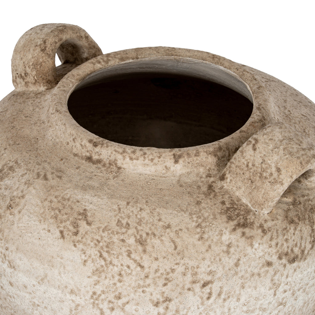 View down into the vase’s broad open mouth, with its thick rim, dark interior and textured shoulders visible.