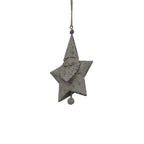 Angled close-up of the Santa star decoration showing the raised face, curled moustache, patterned beard and dark marks across the grey finish.