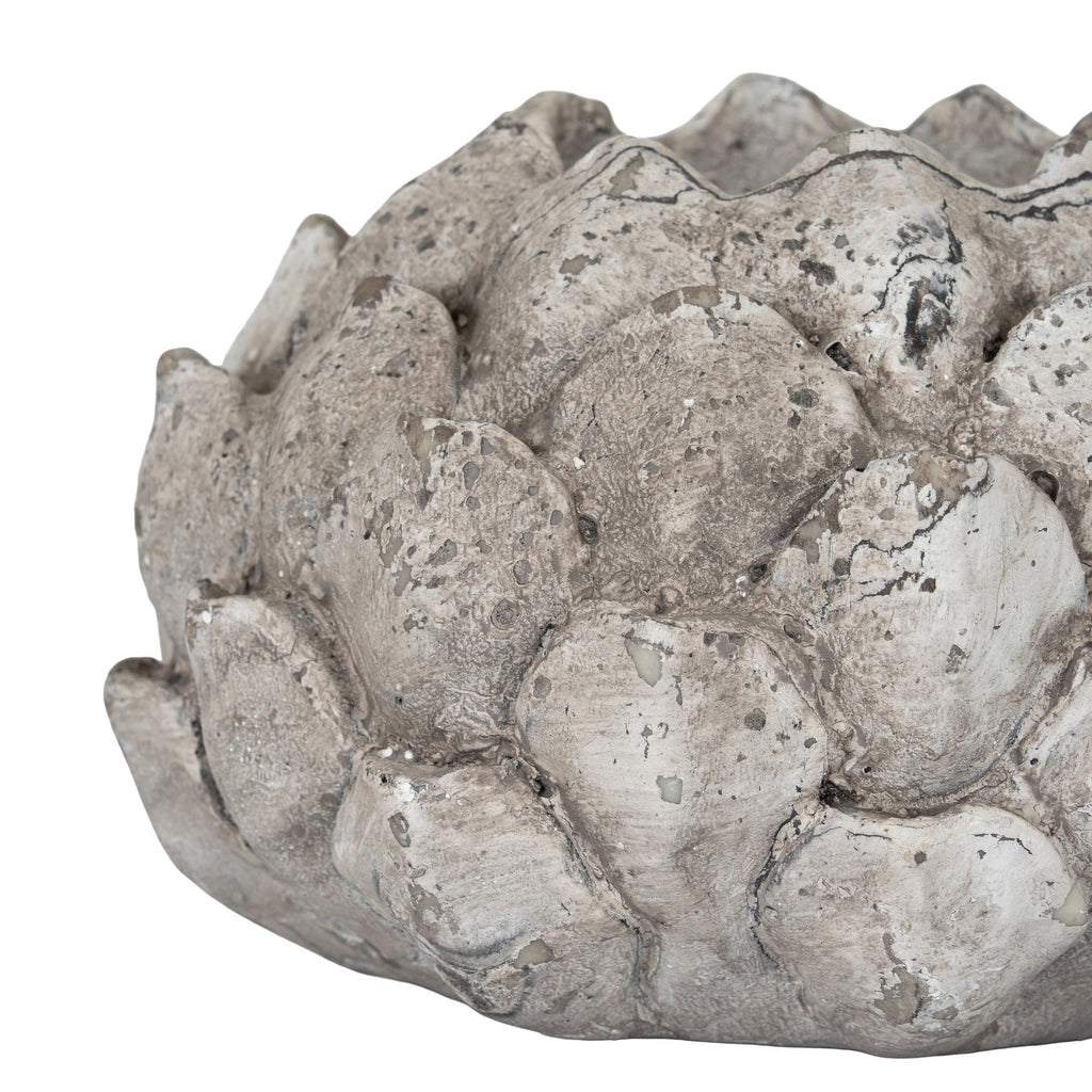 Side detail of the Scale Bud holder showing overlapping scales, pale mottling and dark lines across the textured surface.