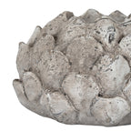 Side detail of the bud-shaped holder, showing layered pointed scales and irregular pale patches over a grey-brown finish.