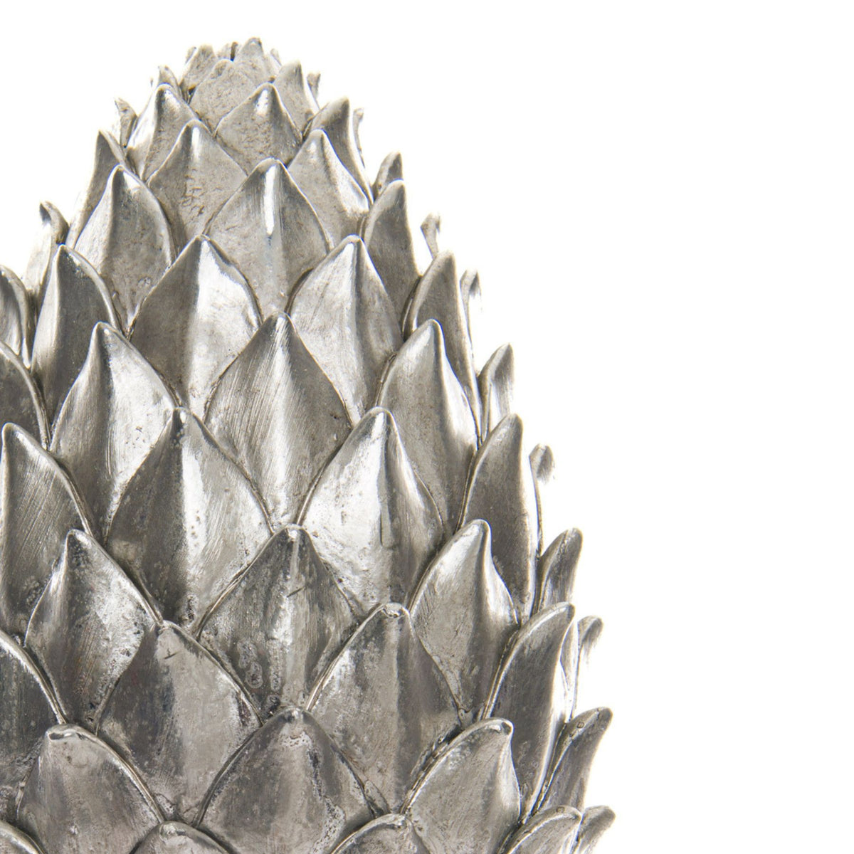 Close-up of the pinecone finial's pointed silver-coloured scales, showing fine surface markings and dark lines between the overlapping layers.