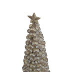 Close view of the tree ornament’s star and upper scalloped tiers, showing pale brushed markings and darker brown edges.