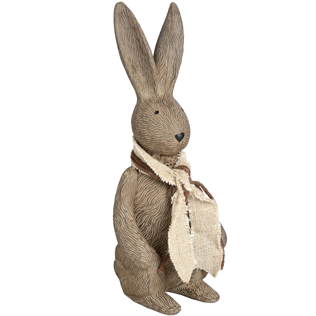 Small brown rabbit ornament viewed from the front at an angle, with long ears and a layered cream and brown scarf.
