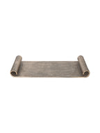 Front view of the antique gold tray with a flat rectangular centre and curled scroll ends against white.