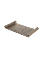 Angled view of the scroll-end tray showing its broad textured base and two inward-curving ends.