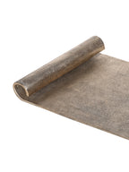 Close-up of one rolled tray end and the finely pitted antique gold surface.