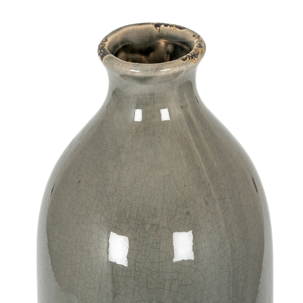 Angled close-up looking into the grey vase opening, showing dark distressed marks around the rim and fine crackle glaze across the shoulders.