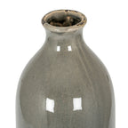 Angled close-up looking into the grey vase opening, showing dark distressed marks around the rim and fine crackle glaze across the shoulders.
