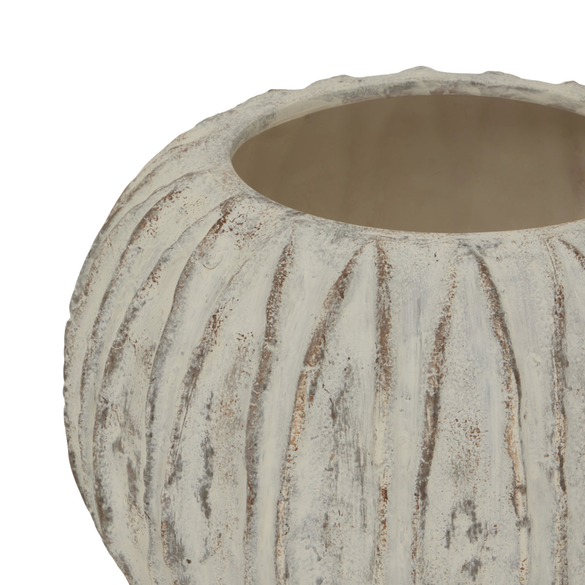 Angled close-up of the vase opening and curved fins, showing grey and brown markings through the pale finish.